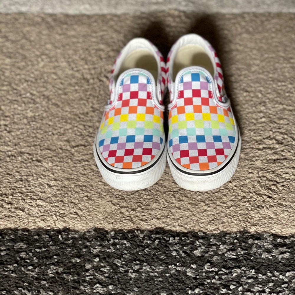 Kids checkerboard slip on vans.